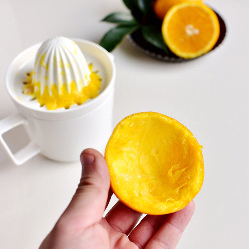Manual ceramic juicer, a healthy drink maker for fresh lemon & orange juice. Essential home kitchen tool.
