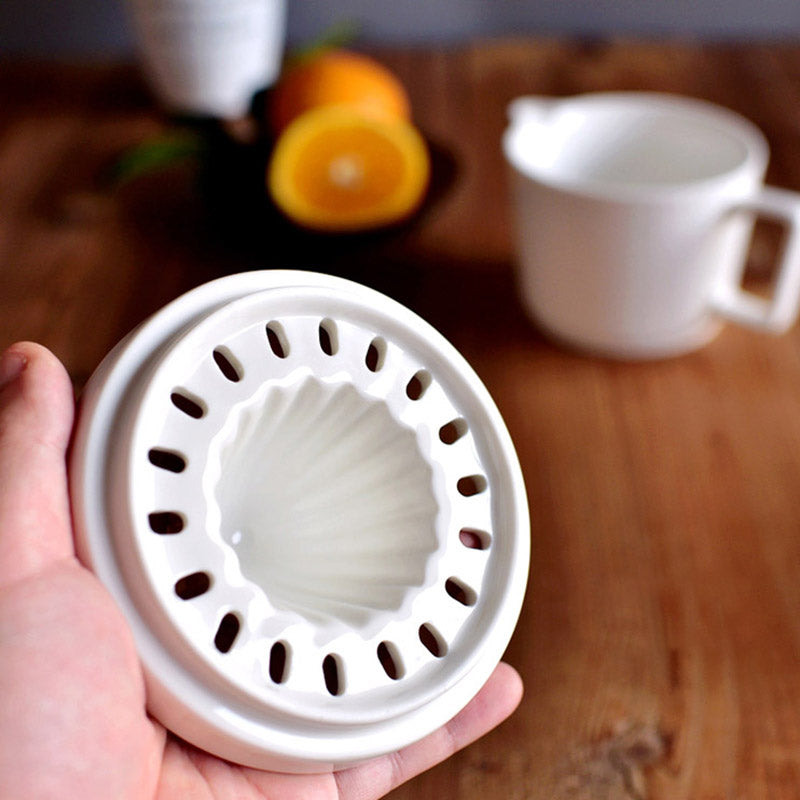 Home kitchen ceramic citrus juicer, perfect for pressing fresh lemon & orange for delicious beverages.