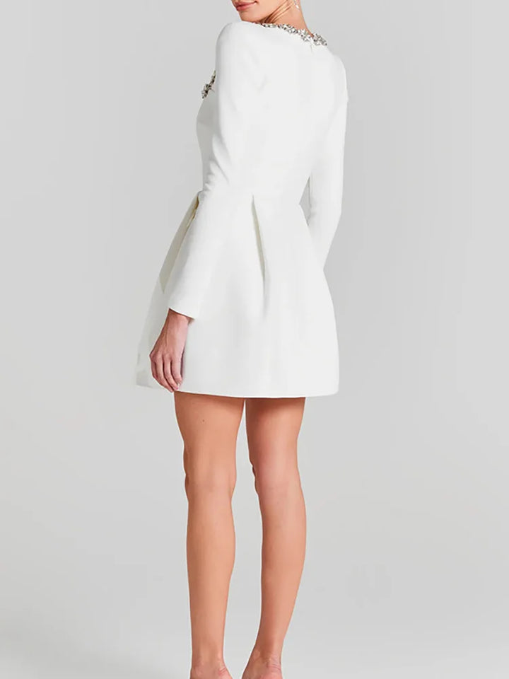 Women's sophisticated black mini dress, long sleeve, square neck, perfect for evening parties.