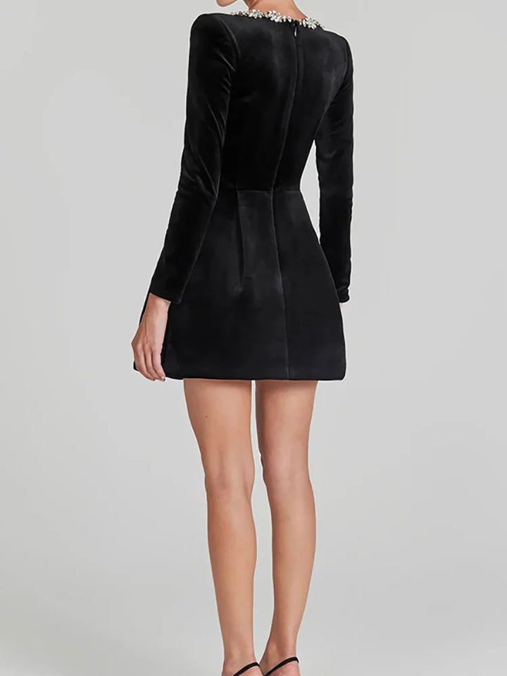 Chic white mini dress, square neckline, long sleeves, ideal for modern bridal parties.