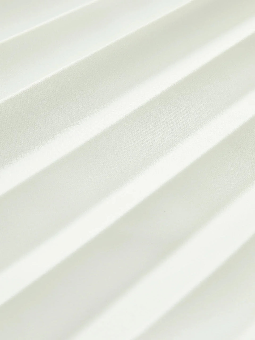 Women's elegant white strapless pleated maxi dress with an asymmetric hem, perfect as a party or formal dress.