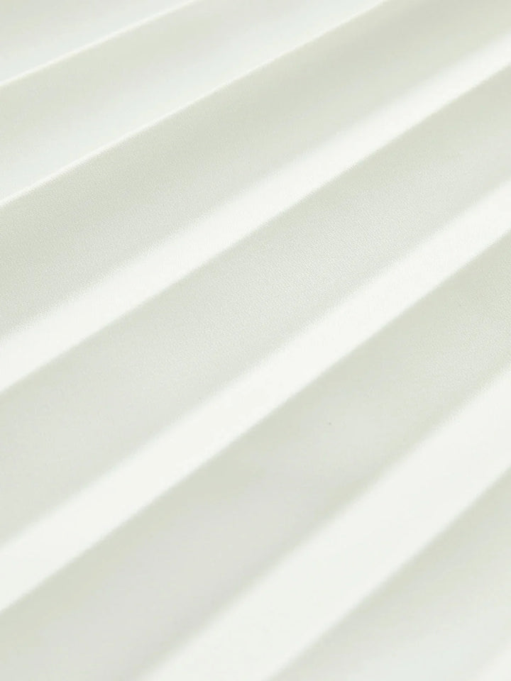 Women's elegant white strapless pleated maxi dress with an asymmetric hem, perfect as a party or formal dress.