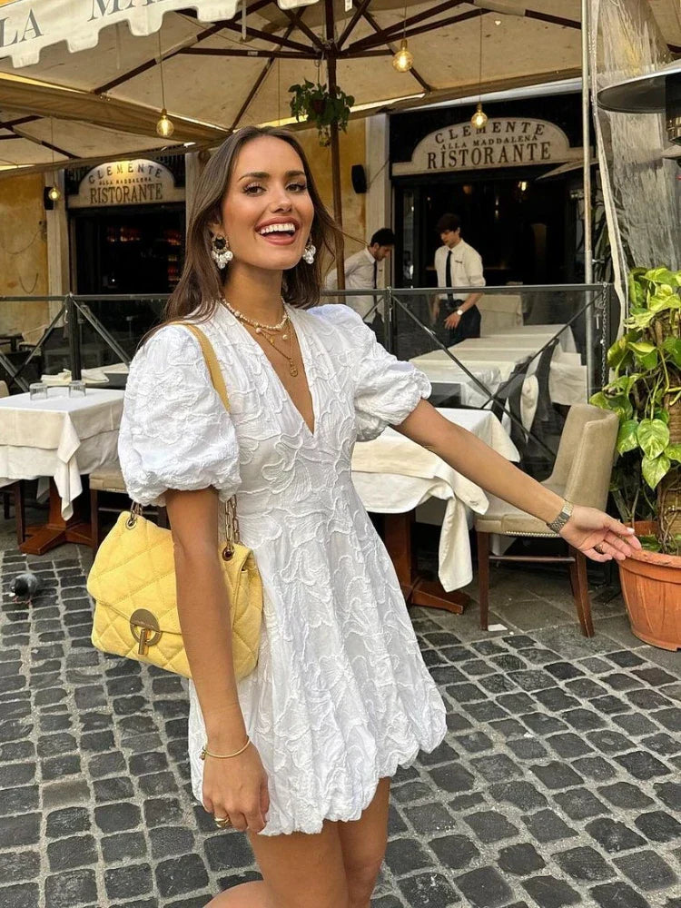White embroidered ruffle A-line summer dress for women, elegant and versatile for casual or holiday wear.