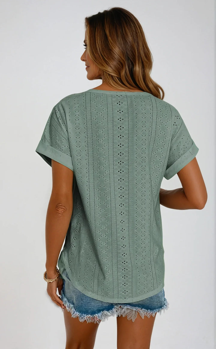 Feminine green eyelet short-sleeve top, a versatile summer casual top with a crew neck & cuffed sleeves.