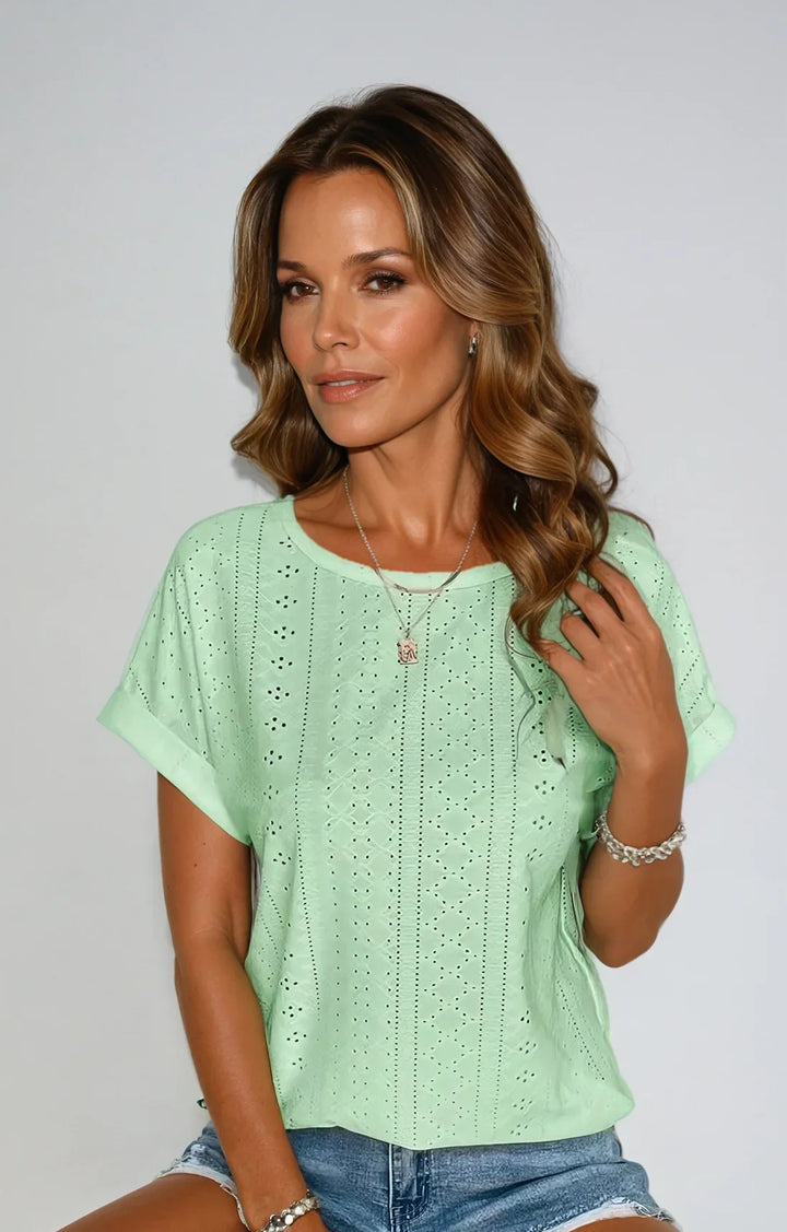 Casual spring/summer eyelet top for women, short-sleeved with a crew neck & stylish cuffed sleeves.
