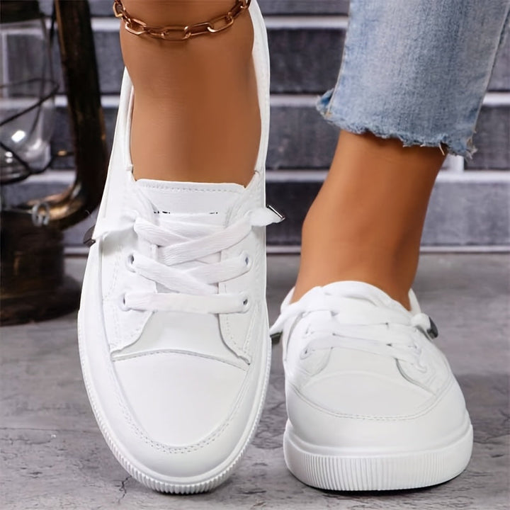 Comfortable white lace-up ladies' trainers, perfect for walking & everyday wear.