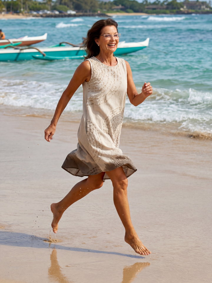 Woman wearing a comfortable white textured midi dress, ideal for relaxed fit casual spring or summer days.
