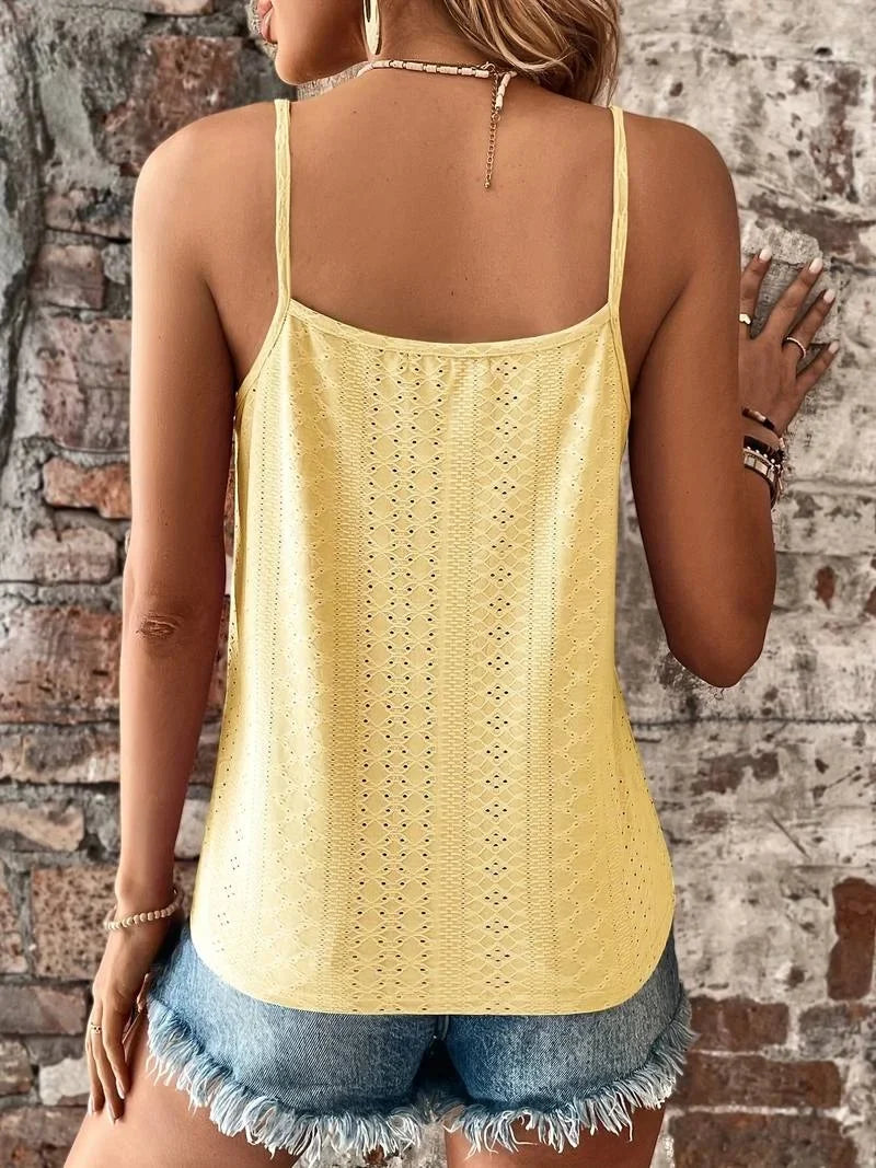 Summer-ready women's top: white embroidered eyelet camisole with V-neck lace detail.