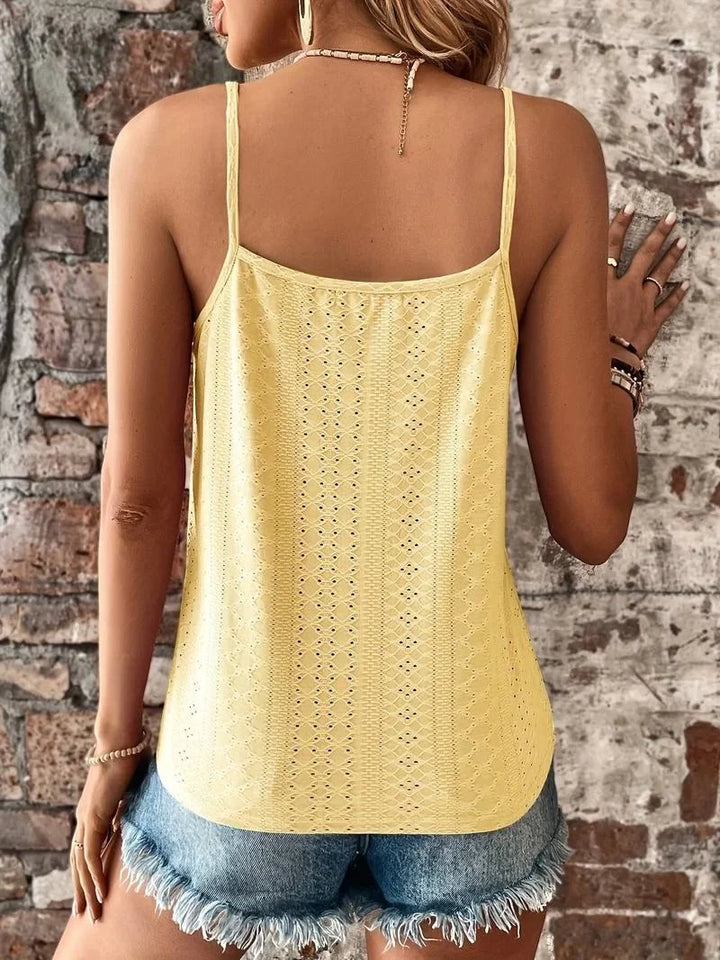 Summer-ready women's top: white embroidered eyelet camisole with V-neck lace detail.