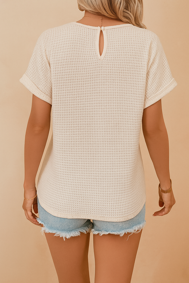 Stylish white women's openwork blouse with an eye-catching decorative neckline, great for casual elegant summer wear.