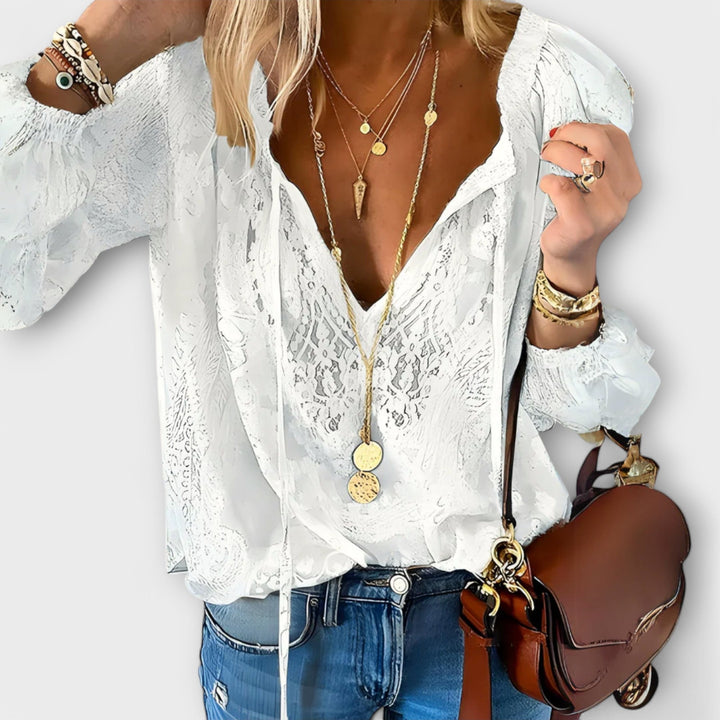 White women's sophisticated lace blouse with tie-neck. Elegant long sleeve top for spring & summer fashion.