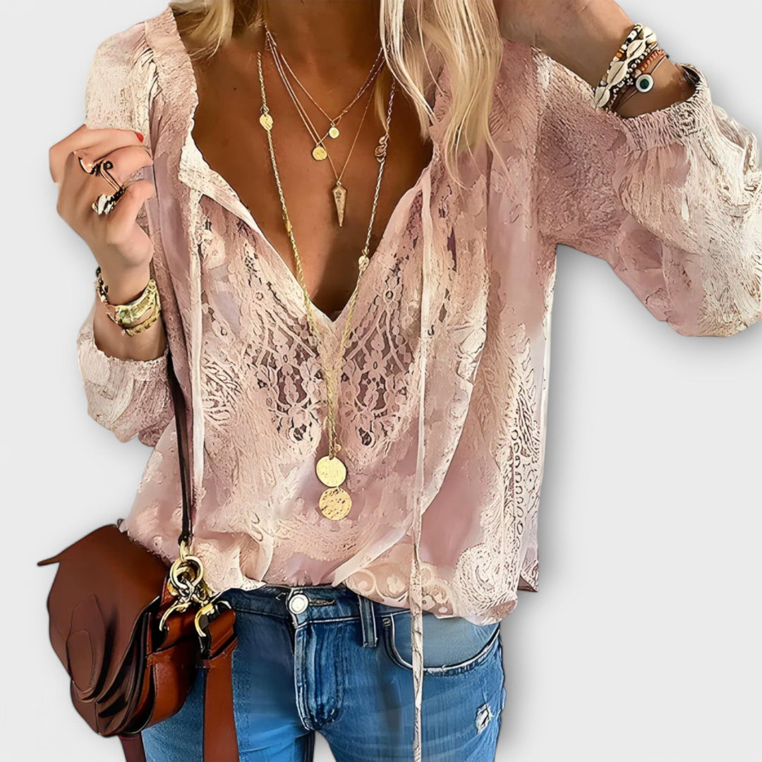 Elegant women's sophisticated lace blouse with tie-neck. Fashionable long sleeve top for versatile spring/summer style.