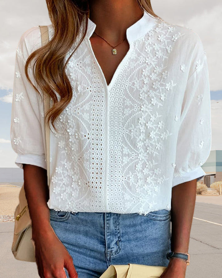 Lightweight white women's V-neck puff sleeve blouse, comfortable for warm weather & summer style.