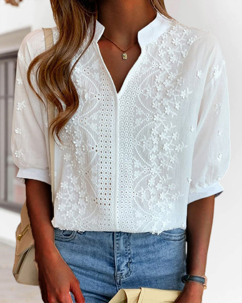 Elegant white V-neck puff sleeve top for women, perfect for warm weather, casual summer fashion.