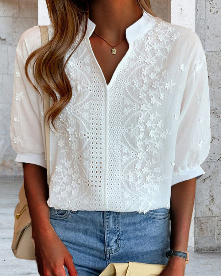 Versatile white women's V-neck blouse featuring fashionable puff sleeves, ideal for summer looks.