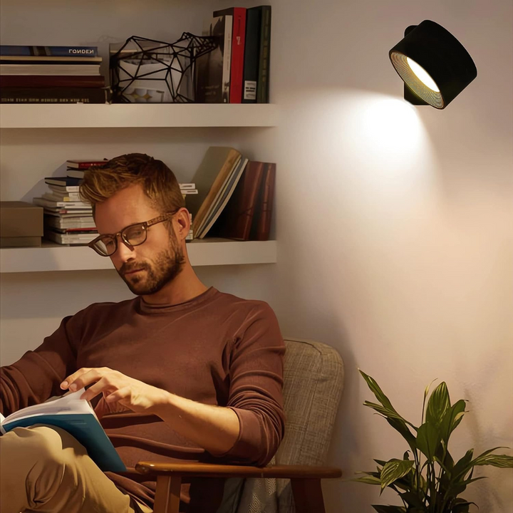 Portable LED wall light, rechargeable & wireless. Features 360° rotation and intuitive touch control.