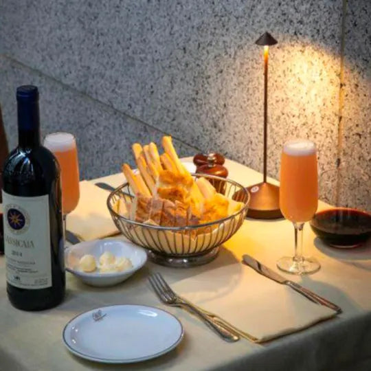Modern wireless LED table lamp with dimmable settings. Ideal for creating ambiance in any contemporary indoor or outdoor space.
