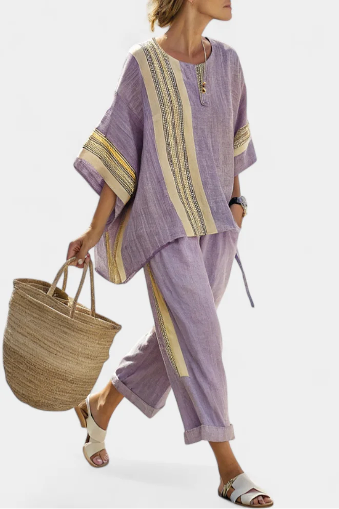 Women's striped oversized top and tapered pants matching set, perfect for chic, relaxed everyday wear.