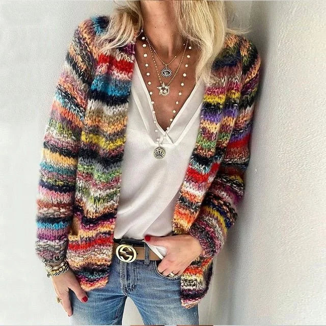 Woman in cozy multicolor open-front cardigan sweater. Loose fit, long sleeve. Perfect for autumn casual wear & layering.