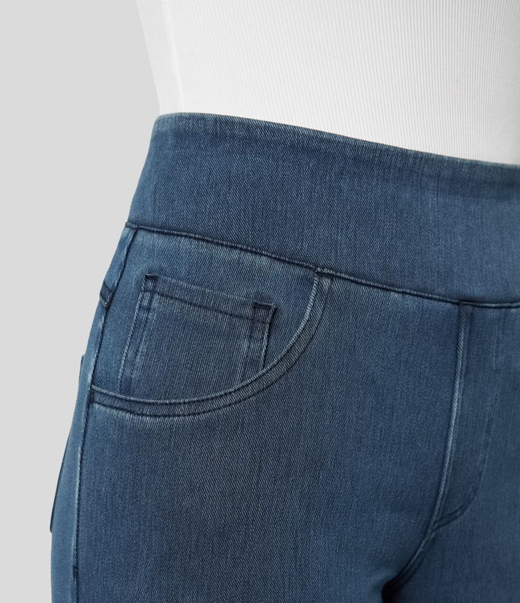 Side view of flowing wide-leg stretch trousers for women, high-waisted design for comfortable autumn fashion.
