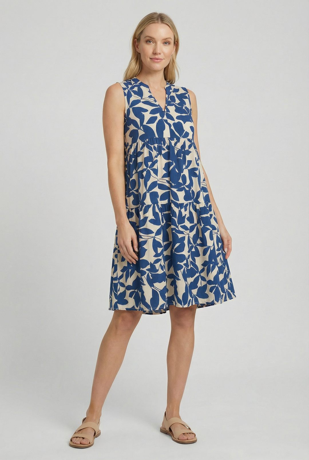 Full body shot of a casual floral mini dress on a model, ideal for beach days.