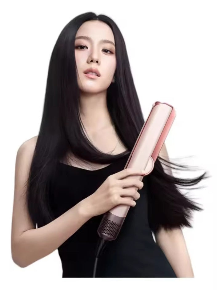 Woman using a 2-in-1 hair dryer straightener to achieve smooth, frizz-free hair quickly.