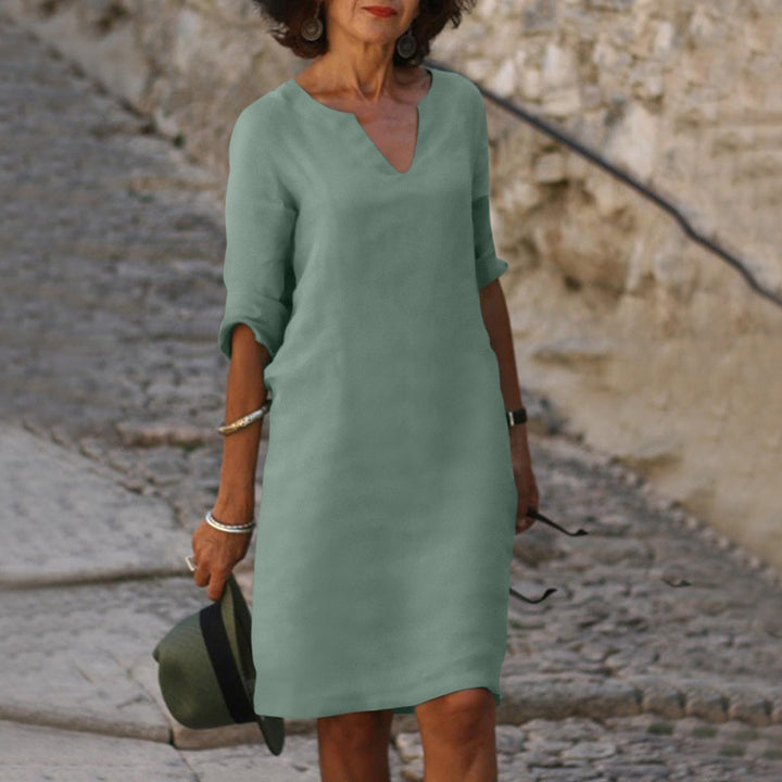 Soft women's 3/4 sleeve shift midi dress, perfect for relaxed everyday fashion.