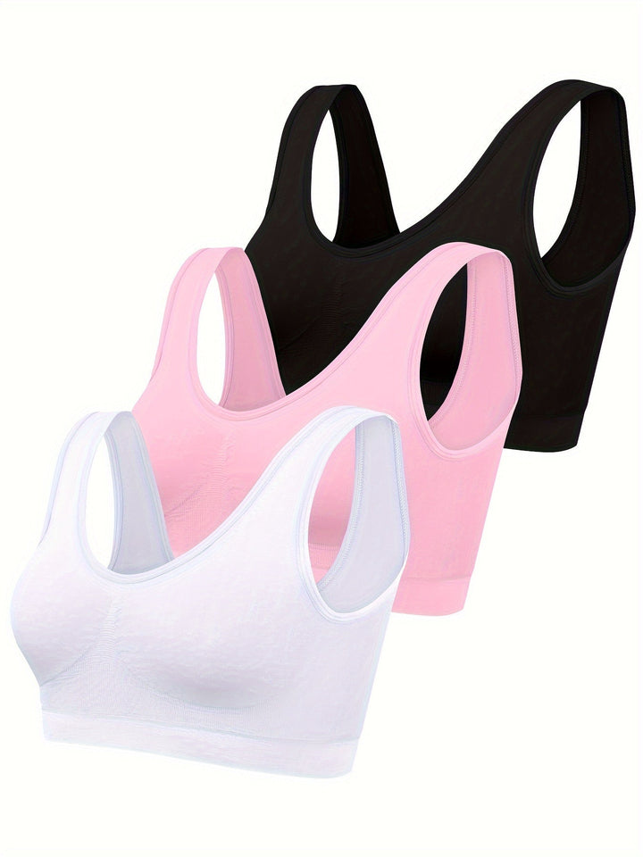 Women's seamless gym wear 3-piece set: supportive sports bra, two tank tops for intense workouts & fitness.