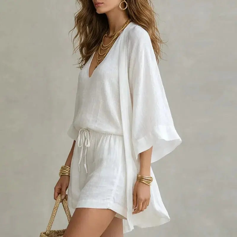 Chic women's linen 3-piece co-ord set: V-neck top, shorts & a versatile layering piece. Ideal for travel & summer.