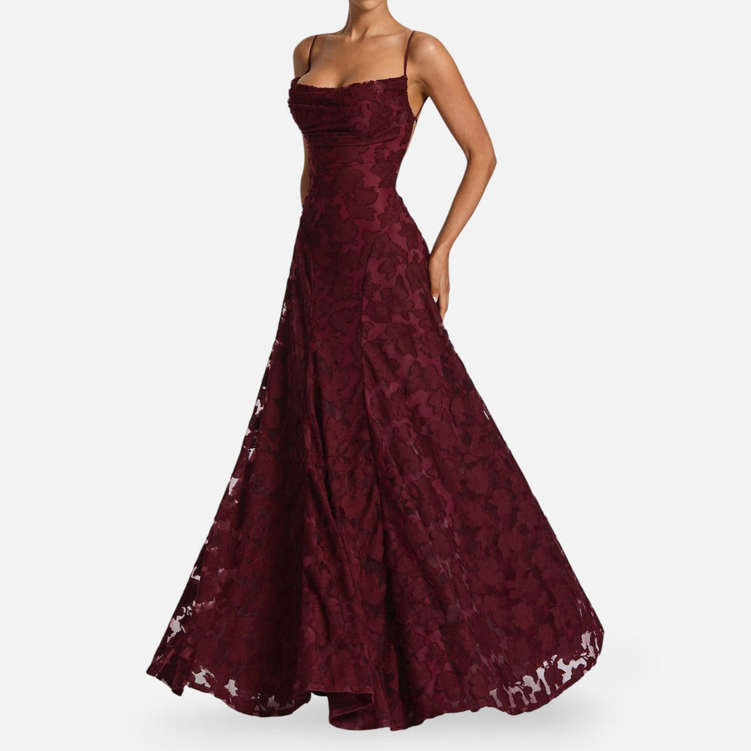 A-line maxi dress with flattering ruched details & thin spaghetti straps, creating a sophisticated silhouette.