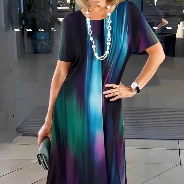 Stylish women's short-sleeve A-Line midi dress, comfortable for summer, featuring a vibrant splatter print.