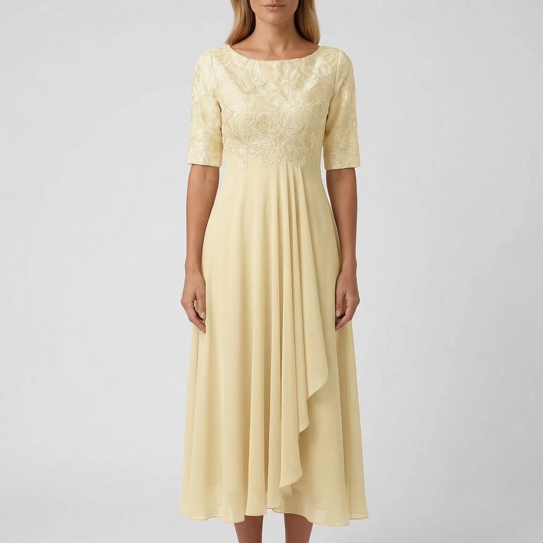 Relaxed fit A-line midi dress for women. Elegant embroidered bodice with floral detail. Summer fashion essential.