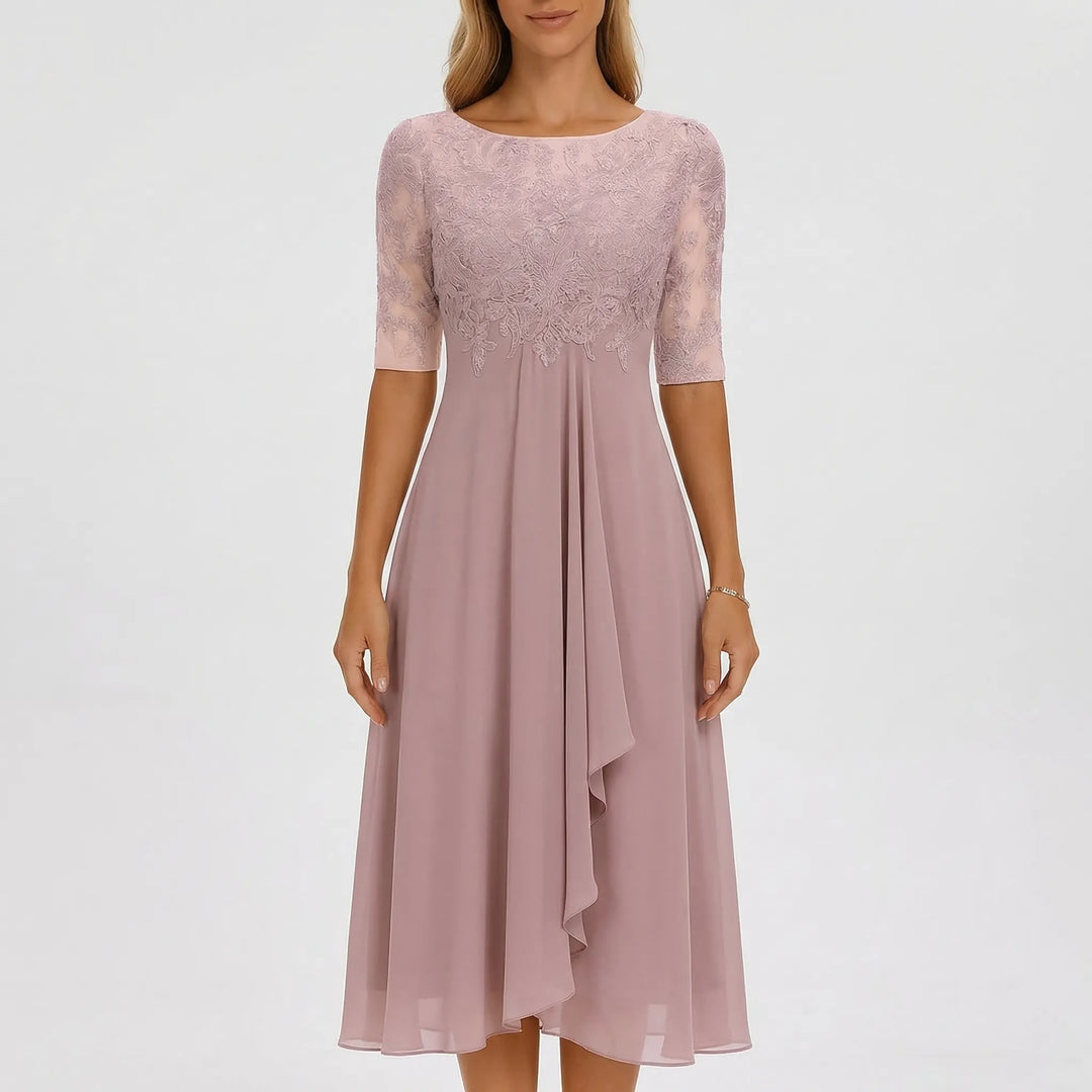 Women's elegant A-line midi dress, showcasing an intricately embroidered bodice & flowing skirt. Summer style.