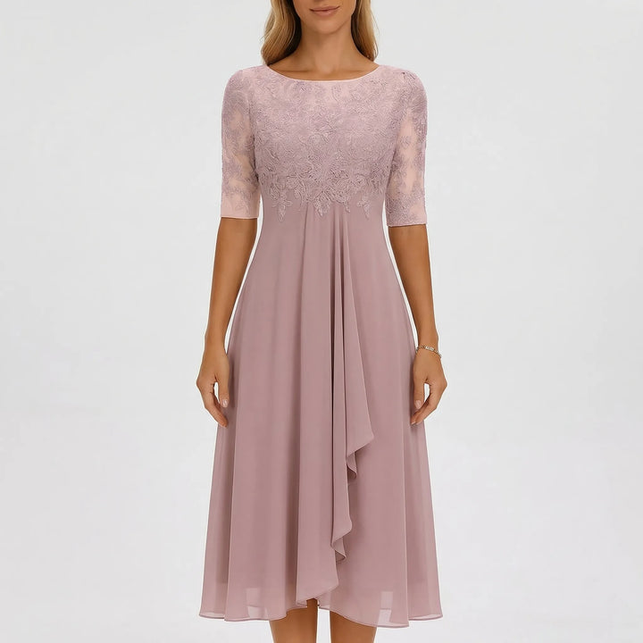 Women's elegant A-line midi dress, showcasing an intricately embroidered bodice & flowing skirt. Summer style.