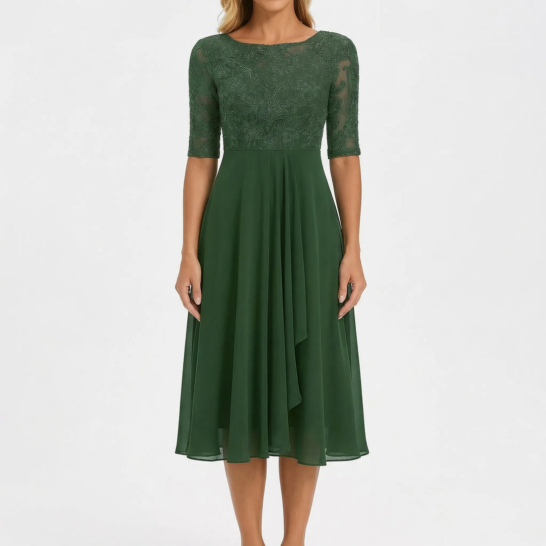 Embroidered A-line midi dress for women. Elegant design with floral details, perfect for summer casual wear.