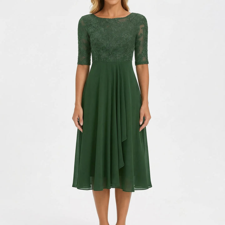 Embroidered A-line midi dress for women. Elegant design with floral details, perfect for summer casual wear.