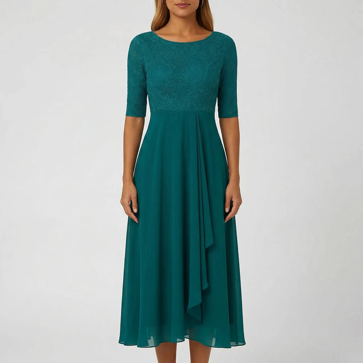 Beautiful A-line midi dress for women, featuring a detailed embroidered bodice and graceful summer silhouette.