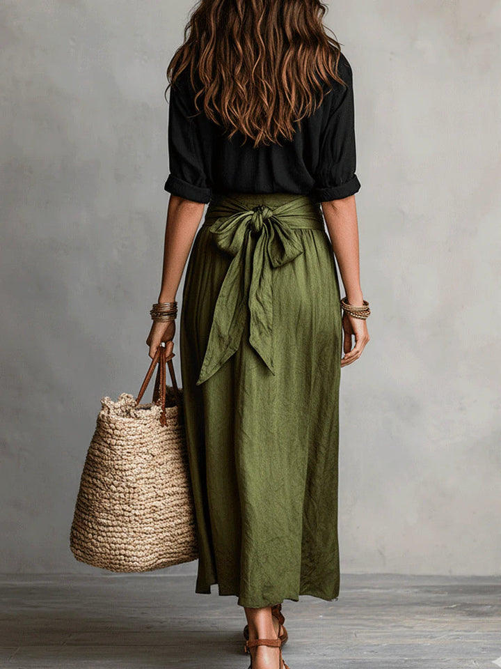 Comfortable women's A-line midi skirt and top set with belt. Versatile two-piece for elegant spring & summer fashion.