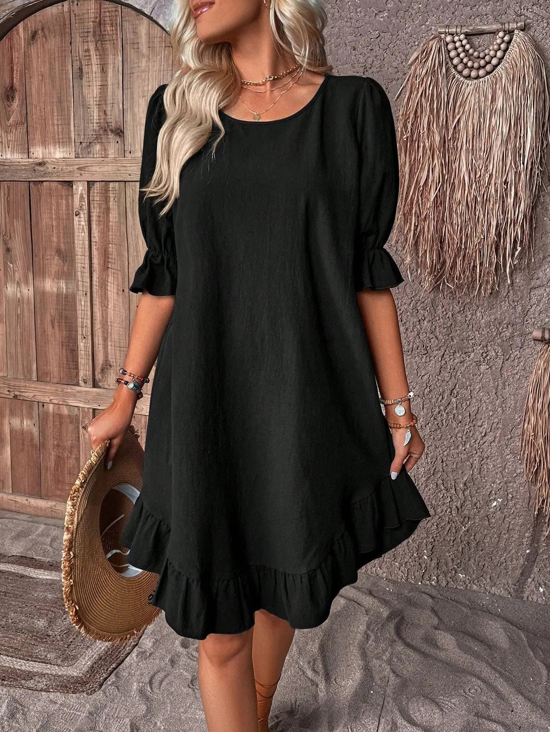Black A-Line summer dress for women, elegant with a ruffle hem and three-quarter sleeves. Versatile day-to-night.