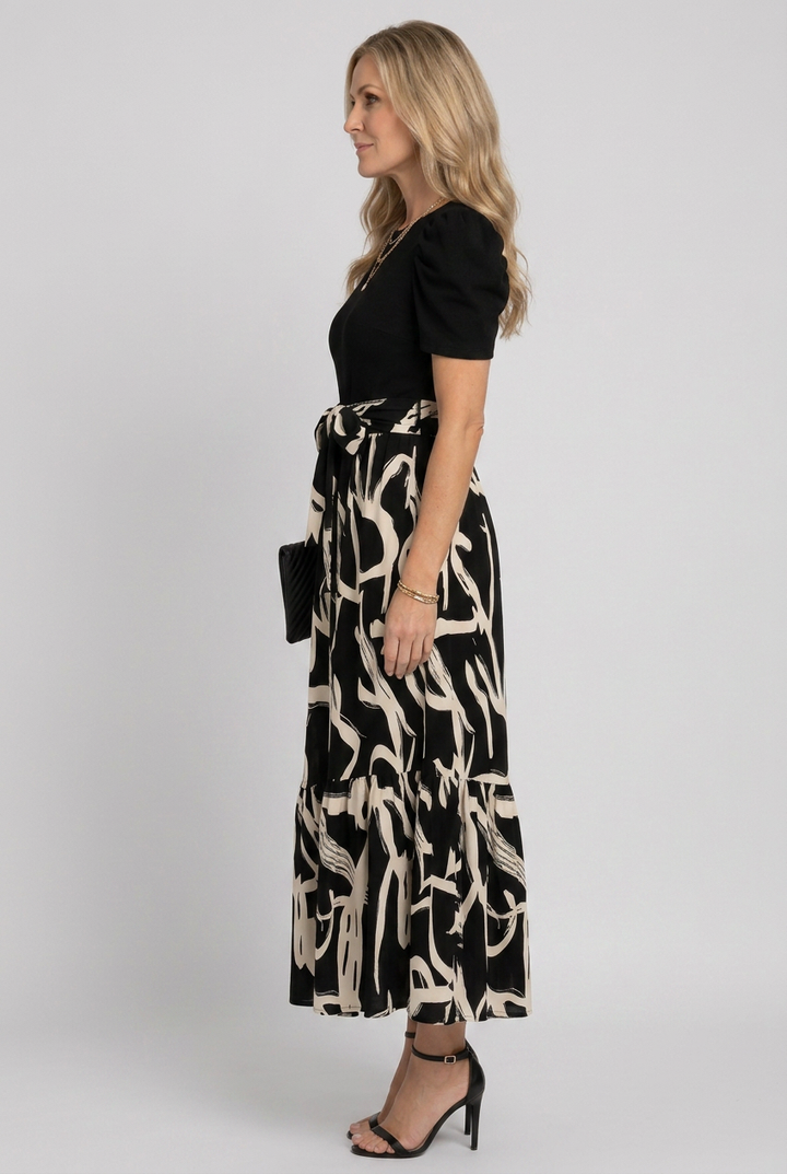Elegant women's flowing maxi dress with an abstract floral print & comfortable short sleeves.