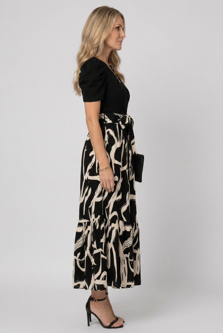 Comfortable women's short sleeve maxi dress featuring a vibrant abstract floral print for casual summer style.