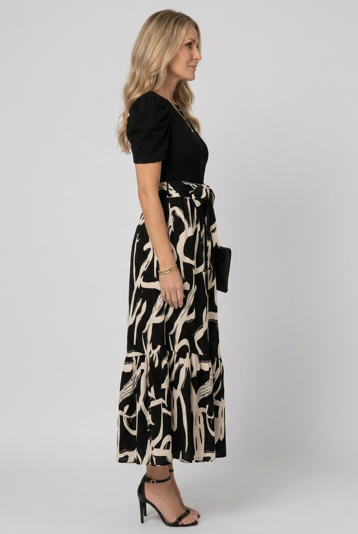 Comfortable women's short sleeve maxi dress featuring a vibrant abstract floral print for casual summer style.