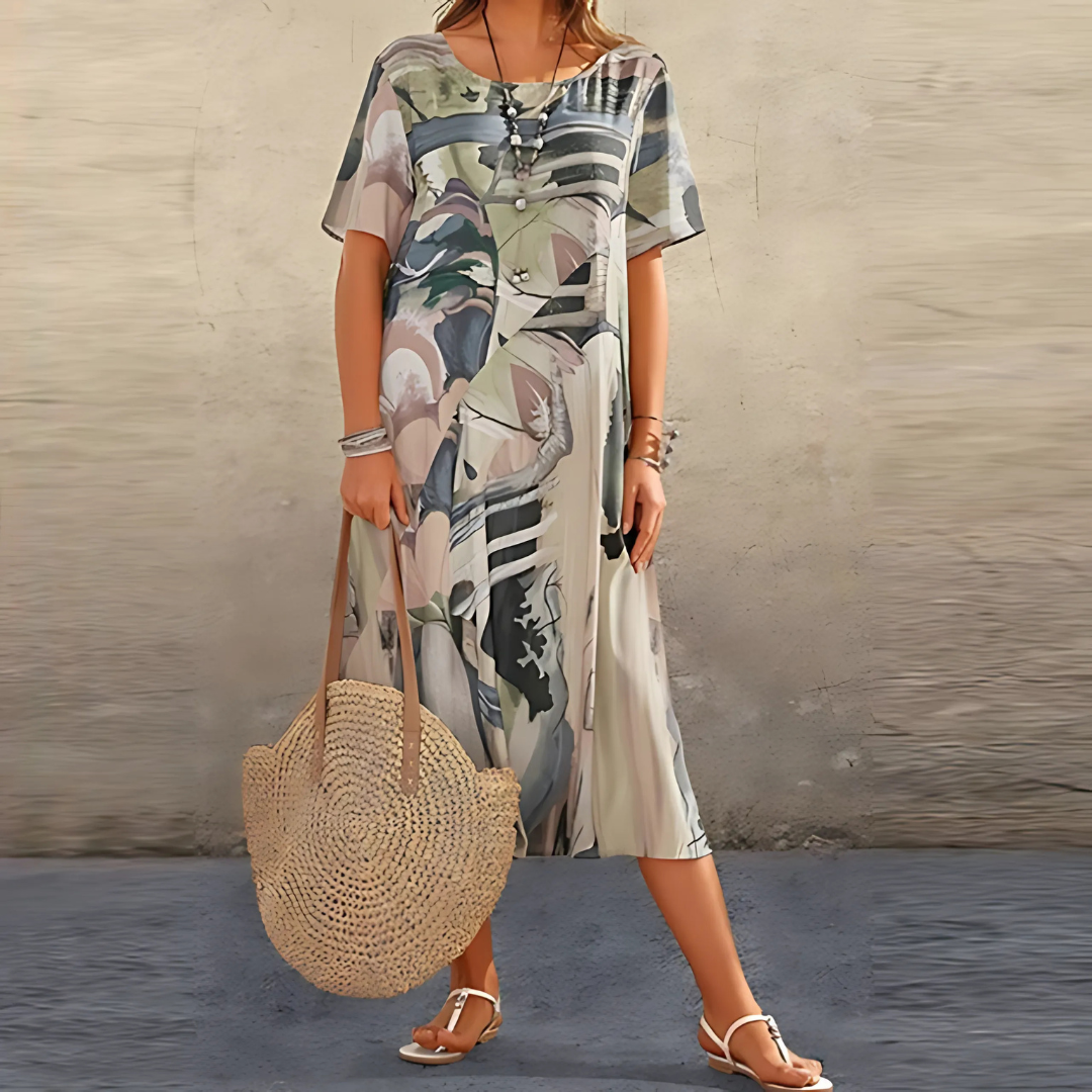 Close-up of a women's abstract pattern flowy midi dress, showcasing the unique print, round neck & soft fabric.