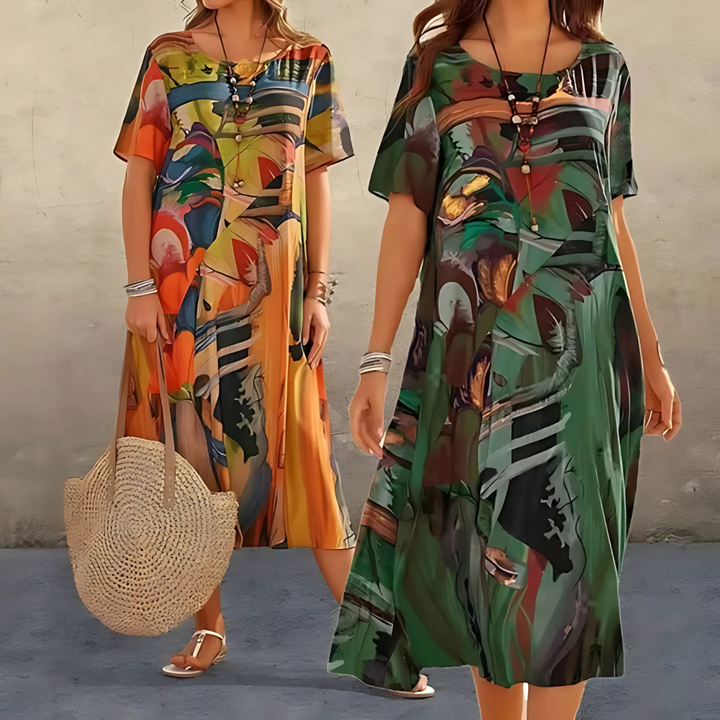 Fashionable women's abstract print midi dress with a relaxed flowy fit, ideal for warm weather and everyday style.