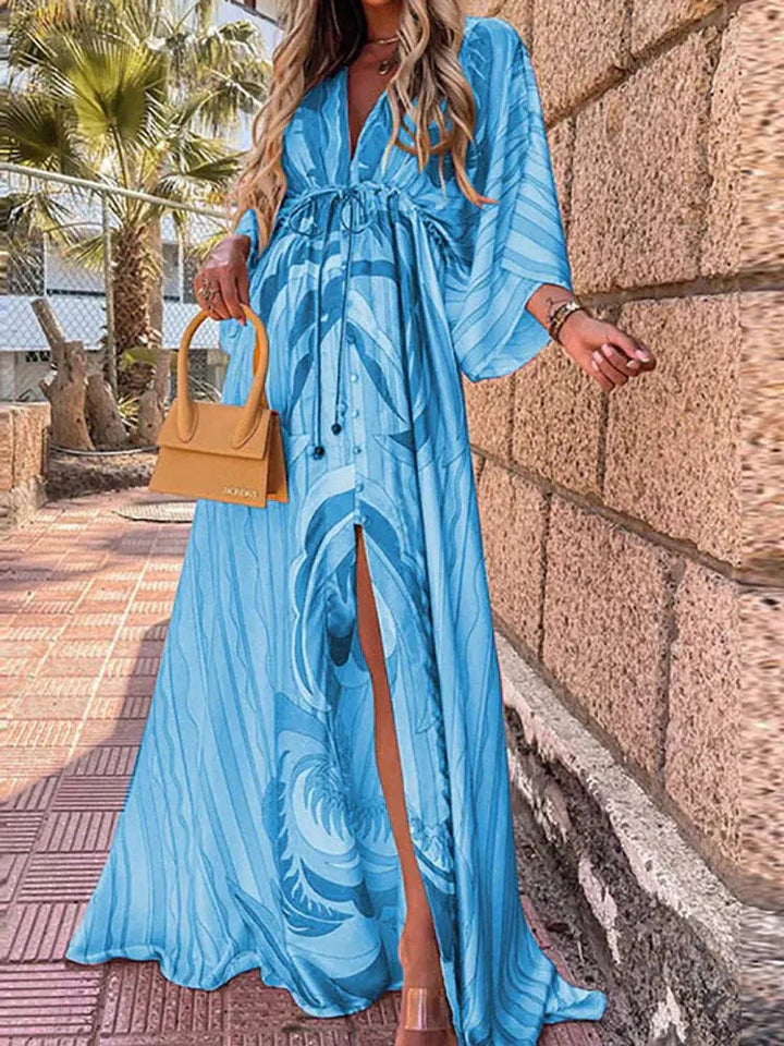 Women's abstract print flowy maxi dress with V-neck, elegant for summer events & resort wear. Kimono sleeve, tie waist.