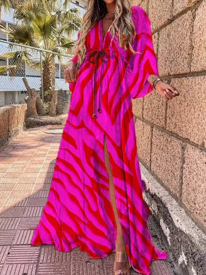 Bohemian women's V-neck maxi dress with abstract print, perfect for summer, resort, or elegant events. Flowy & long.