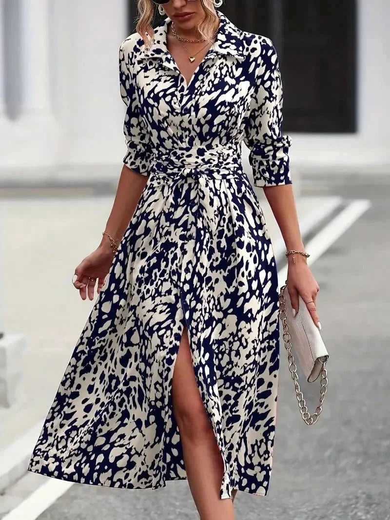 Chic women's abstract print midi shirt dress with 3/4 sleeves & a flattering belt. Button-down, casual elegance.