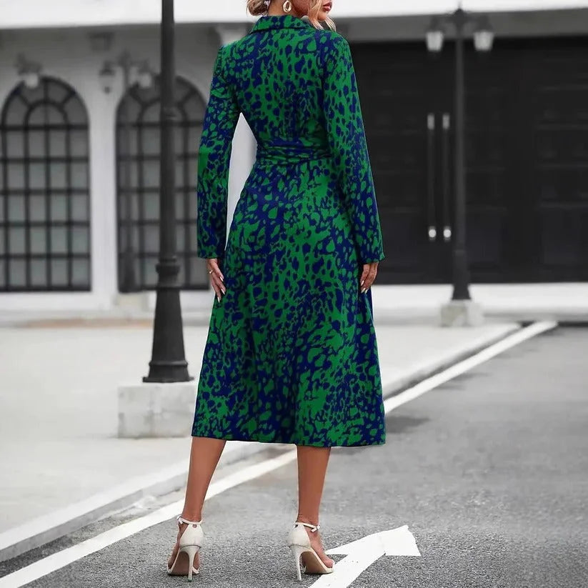 Statement women's abstract print midi shirt dress. Features 3/4 sleeves & button-down front for an elegant look.