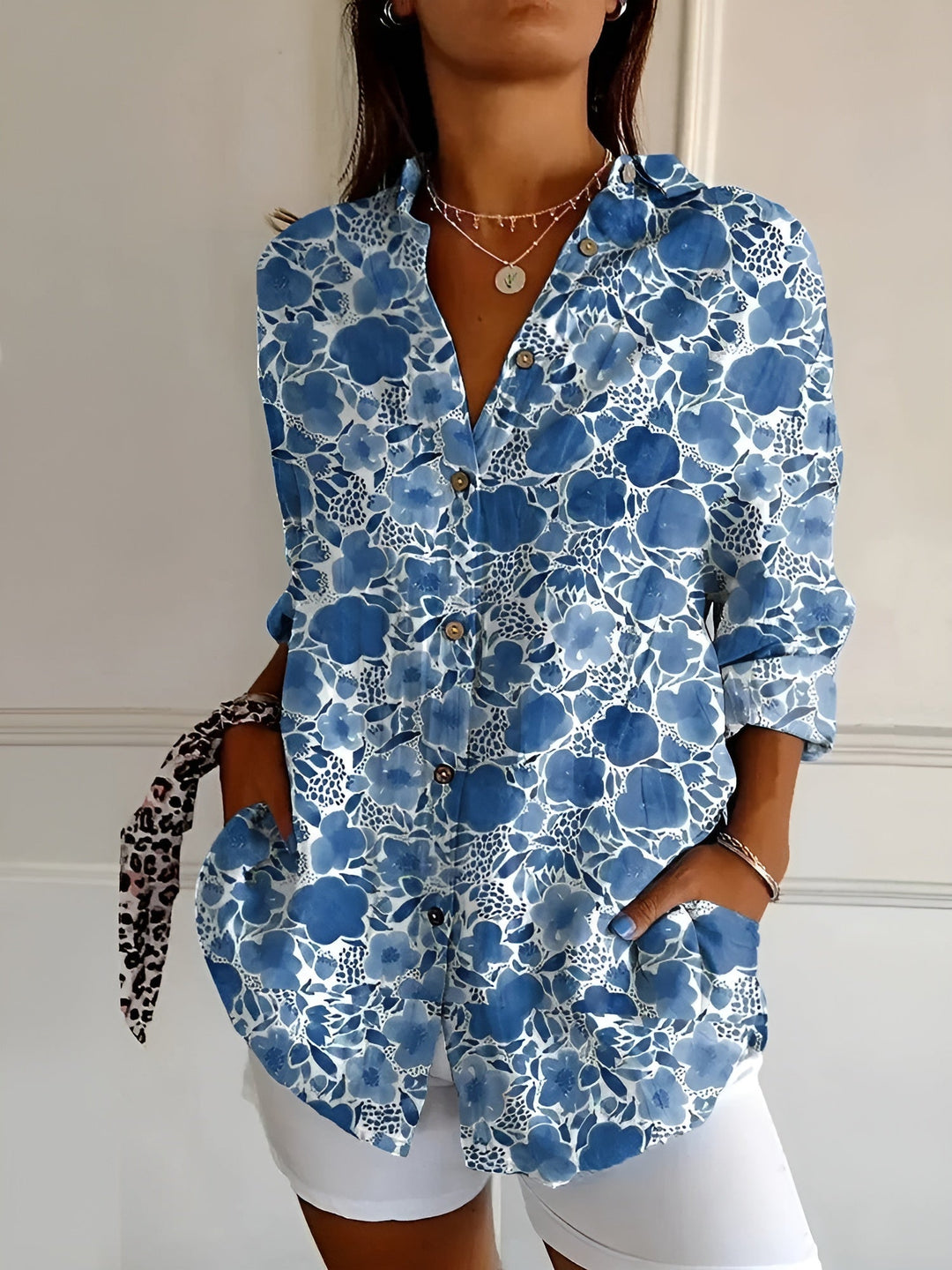 Women's abstract print split neck blouse with long sleeves, perfect for casual everyday style.