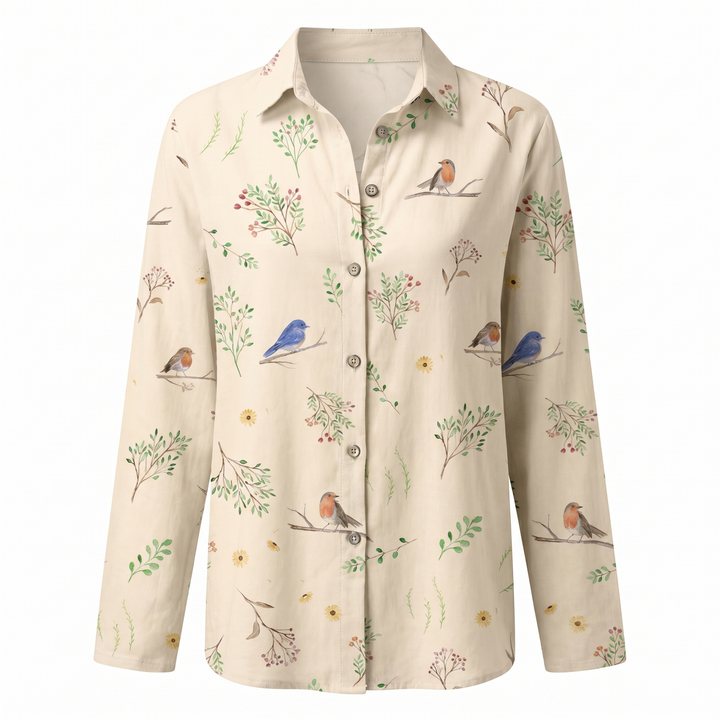Casual women's split neck blouse, adorned with a modern abstract print and long sleeves.